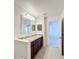 Bathroom with double vanity, granite countertop, and access to bedroom at 524 Sardinia Cir, Davenport, FL 33837