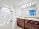 Bathroom with shower stall, double vanity, and granite countertop at 524 Sardinia Cir, Davenport, FL 33837