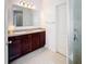 Bathroom with double sinks, shower, and granite countertop at 524 Sardinia Cir, Davenport, FL 33837