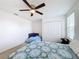 Bedroom with two beds, closet, and ceiling fan at 524 Sardinia Cir, Davenport, FL 33837