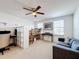 Loft bedroom with built-in bunk bed, seating area and ceiling fan at 524 Sardinia Cir, Davenport, FL 33837
