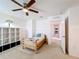 Spacious bedroom with built-in shelving and ceiling fan at 524 Sardinia Cir, Davenport, FL 33837