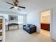 Spacious bedroom with built-in bunk bed, seating, and ensuite bath at 524 Sardinia Cir, Davenport, FL 33837