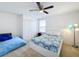 Bedroom with two beds, window, and ceiling fan at 524 Sardinia Cir, Davenport, FL 33837