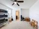 Bedroom featuring a ceiling fan, and large window at 524 Sardinia Cir, Davenport, FL 33837