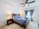 Bright bedroom with a king-size bed and large window at 524 Sardinia Cir, Davenport, FL 33837