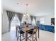Dining area with a wooden table and chairs, near sliding doors at 524 Sardinia Cir, Davenport, FL 33837