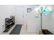 Bright entryway with tile flooring, shoe storage, and access to stairs at 524 Sardinia Cir, Davenport, FL 33837