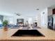 Kitchen island with granite countertop and black sink at 524 Sardinia Cir, Davenport, FL 33837