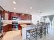Kitchen with dark wood cabinets and granite countertops at 524 Sardinia Cir, Davenport, FL 33837