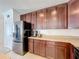 Modern kitchen with granite countertops and dark wood cabinets at 524 Sardinia Cir, Davenport, FL 33837