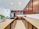 Open concept kitchen with granite counters and stainless steel appliances at 524 Sardinia Cir, Davenport, FL 33837
