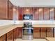 Stainless steel appliances and granite countertops in kitchen at 524 Sardinia Cir, Davenport, FL 33837