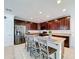 Spacious kitchen with stainless steel appliances and granite countertops at 524 Sardinia Cir, Davenport, FL 33837