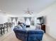 Living room with sectional sofa and large flat-screen TV at 524 Sardinia Cir, Davenport, FL 33837