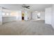 Large loft bedroom with carpet, ceiling fan and access to bathroom at 524 Sardinia Cir, Davenport, FL 33837