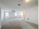 Bright loft area with carpeted flooring and ceiling fan at 524 Sardinia Cir, Davenport, FL 33837