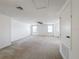 Spacious loft area with carpeted flooring and ceiling fan at 524 Sardinia Cir, Davenport, FL 33837