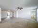 Spacious loft area with carpeted flooring and ceiling fan at 524 Sardinia Cir, Davenport, FL 33837