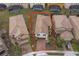 Aerial view of a two story house with a driveway at 5505 Misty Oak Cir, Davenport, FL 33837