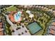 Aerial view of community amenities including pools and tennis court at 5505 Misty Oak Cir, Davenport, FL 33837