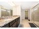 Large bathroom with double vanity and walk-in shower at 5505 Misty Oak Cir, Davenport, FL 33837