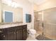 Bathroom with granite vanity and large walk-in shower at 5505 Misty Oak Cir, Davenport, FL 33837