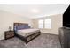 Spacious bedroom with carpeting and large windows at 5505 Misty Oak Cir, Davenport, FL 33837