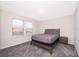 Bright bedroom with neutral walls and carpet flooring at 5505 Misty Oak Cir, Davenport, FL 33837