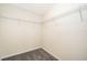 Walk-in closet with wire shelving and neutral walls at 5505 Misty Oak Cir, Davenport, FL 33837