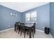 Dining room with dark wood table and chairs, and a window at 5505 Misty Oak Cir, Davenport, FL 33837