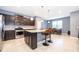 Open concept kitchen, granite counters, stainless steel appliances at 5505 Misty Oak Cir, Davenport, FL 33837
