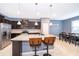 Island kitchen with granite countertops and breakfast bar at 5505 Misty Oak Cir, Davenport, FL 33837
