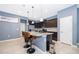 Kitchen with dark cabinets, granite counters, and island with seating at 5505 Misty Oak Cir, Davenport, FL 33837