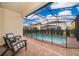 Screened-in pool with brick pavers and fenced backyard at 5505 Misty Oak Cir, Davenport, FL 33837