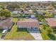 Aerial view of single-story house with solar panels, large backyard, and pool at 7804 Acadian Dr, Orlando, FL 32822