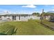 Large backyard with grassy lawn and basketball hoop at 7804 Acadian Dr, Orlando, FL 32822