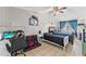 Bedroom with a double bed, ceiling fan, and nautical-themed decor at 7804 Acadian Dr, Orlando, FL 32822