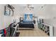 Bedroom with twin beds, ceiling fan, and built-in shelving at 7804 Acadian Dr, Orlando, FL 32822