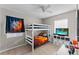 Bedroom with bunk beds, featuring a sports-themed wall decor at 7804 Acadian Dr, Orlando, FL 32822