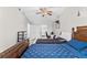 Spacious bedroom with double bed, ceiling fan and access to workspace at 7804 Acadian Dr, Orlando, FL 32822
