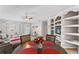 Casual dining area with a round table, built-in shelving, and red placemats at 7804 Acadian Dr, Orlando, FL 32822