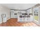 Kitchen boasts white cabinets, tile flooring, and a breakfast bar at 7804 Acadian Dr, Orlando, FL 32822