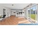 Open concept kitchen with white cabinets and access to backyard at 7804 Acadian Dr, Orlando, FL 32822