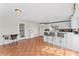 Bright kitchen with white cabinets, tile floor, and breakfast bar at 7804 Acadian Dr, Orlando, FL 32822