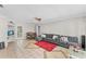 Spacious living room with grey sectional sofa and dining area at 7804 Acadian Dr, Orlando, FL 32822