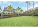 Landscaped backyard with grassy area and privacy fence at 8162 Valhalla Ter, Reunion, FL 34747