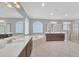 Luxurious bathroom with double vanity, soaking tub, and walk-in shower at 8162 Valhalla Ter, Reunion, FL 34747