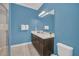 Modern bathroom with a vanity and shower at 8162 Valhalla Ter, Reunion, FL 34747