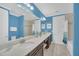 Bathroom boasts double vanity, a large mirror and a bathtub at 8162 Valhalla Ter, Reunion, FL 34747